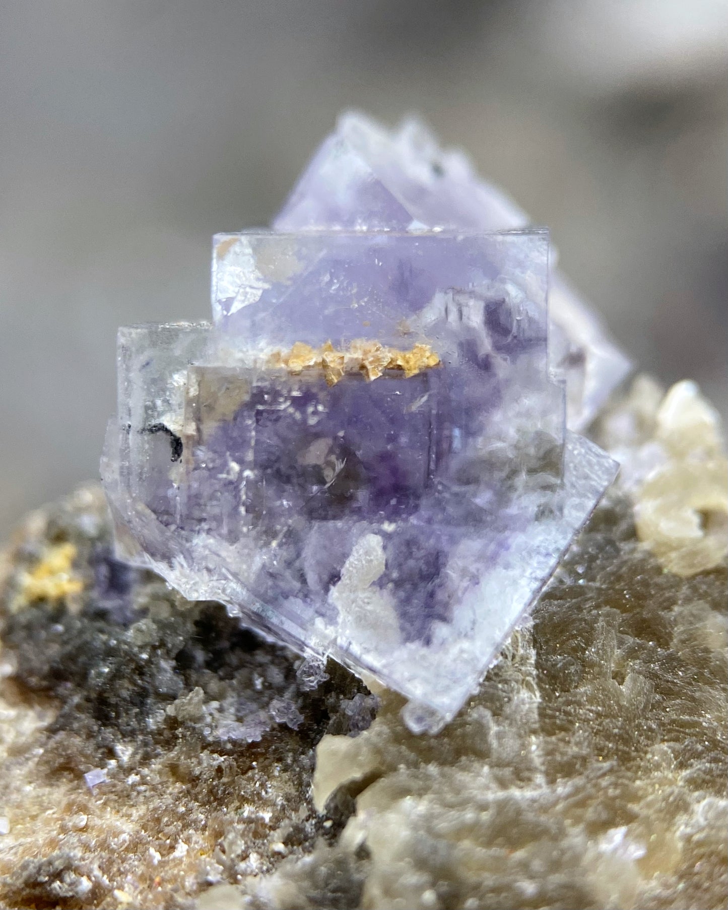 Purple Cubic Fluorite with Orange Inclusion on Muscovite